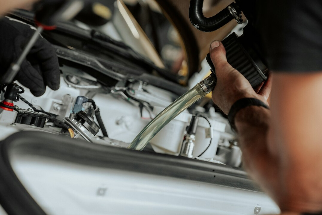 mechanic checking car engine