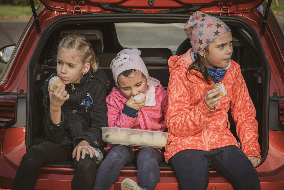 family in luxury suv