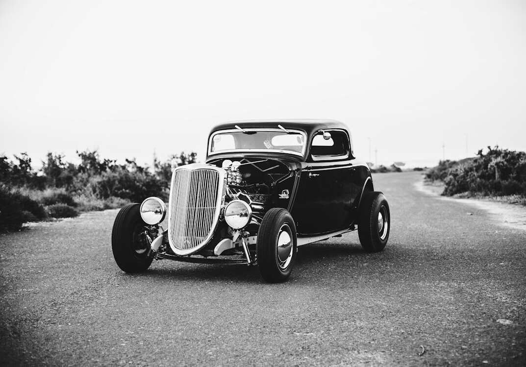 Restored 1930s roadster automobile photographed in a studio setting