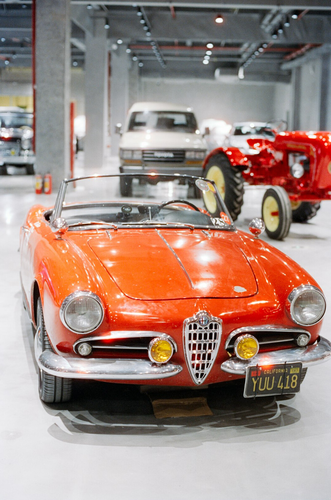 Interior of a classic car museum with vintage automobiles on display